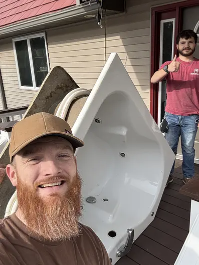Rare Gem crew removing an old jetted tub from a home